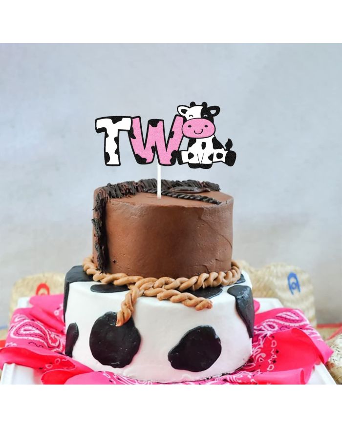 Two tier cow theme cake.JPG